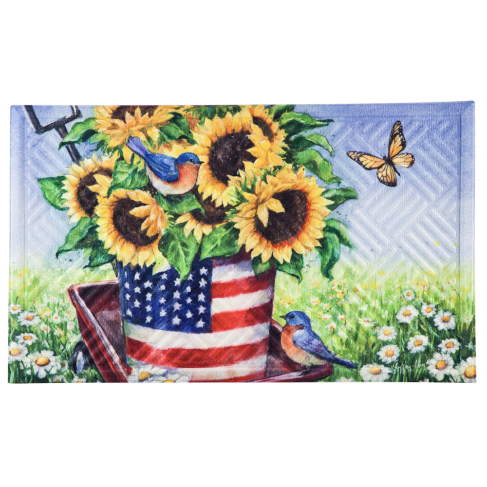 An embossed floor mat featuring sunflowers in a patriotic stars-and-stripes bucket inside a red garden wagon.