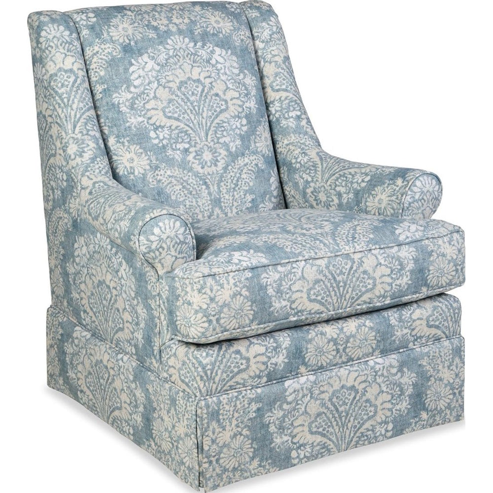 Upholstered armchair featuring a light blue and white damask floral pattern with rolled arms.