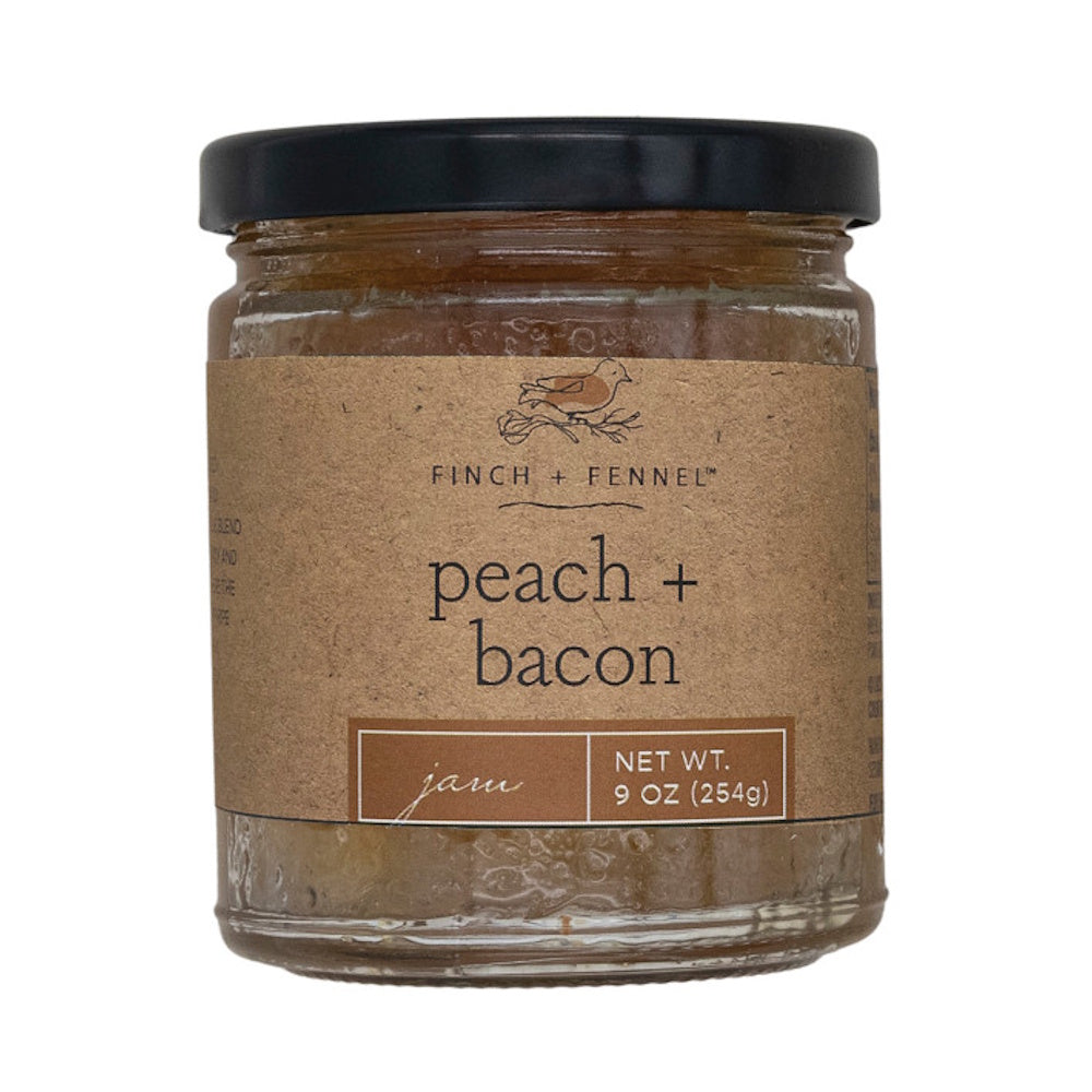 Finch + Fennel peach and bacon jam jar with a brown kraft paper label, isolated on a white background.