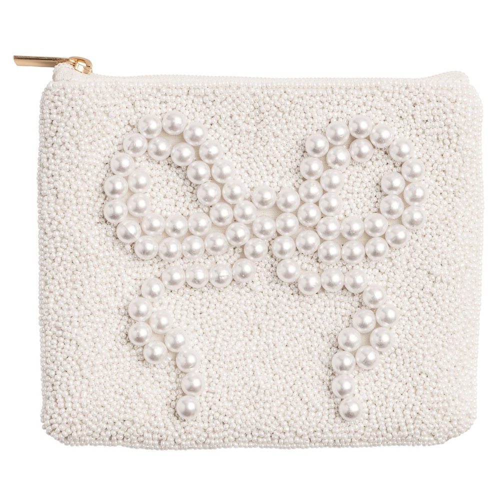 White beaded pouch with a large pearl bow design and gold zipper on a white background.