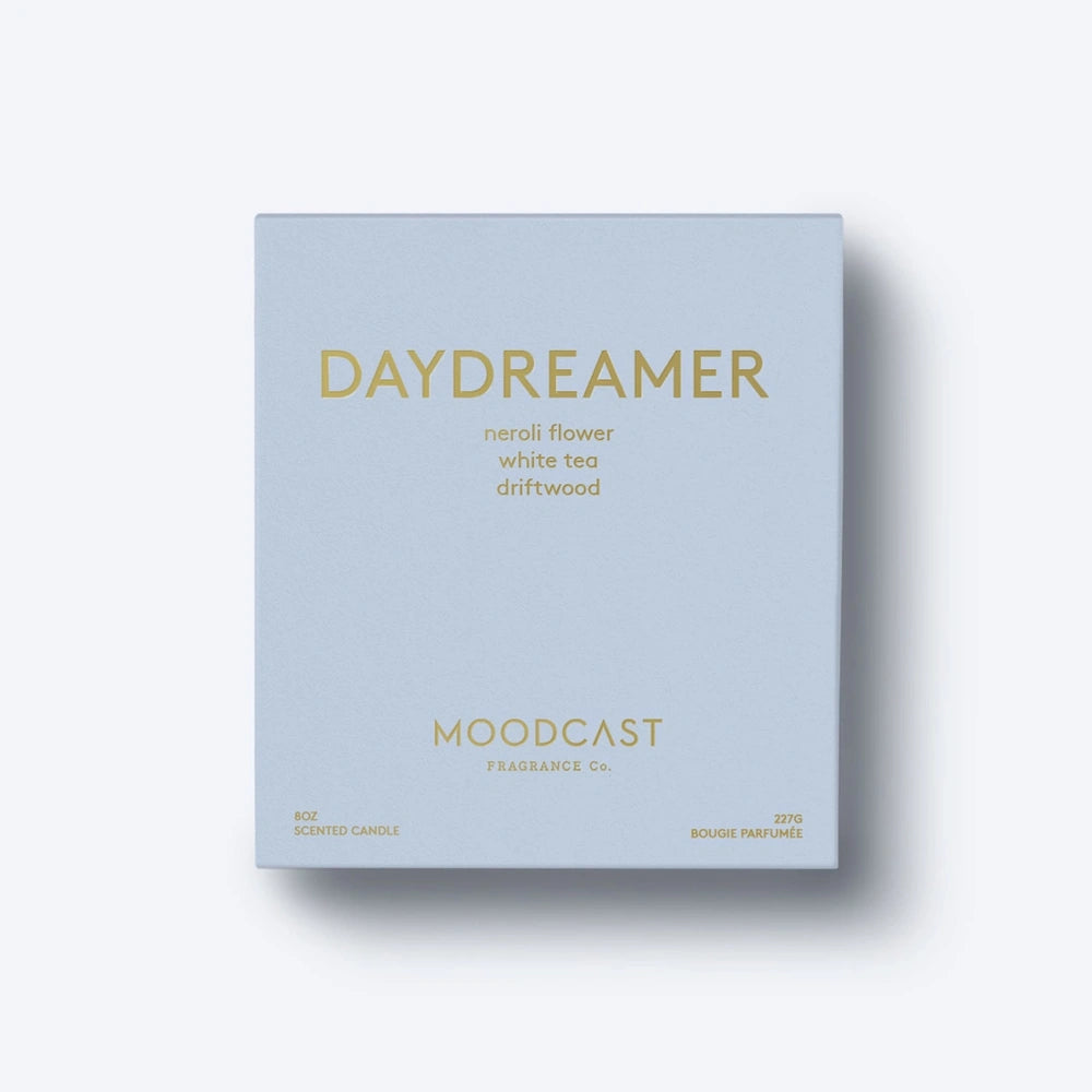 Moodcast Daydreamer scented candle box in light blue with gold foil text lettering.