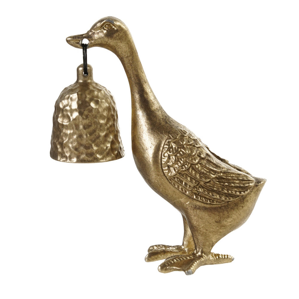A brass-colored pewter duck figurine holding a textured, bell-shaped candle snuffer dangling from its beak.