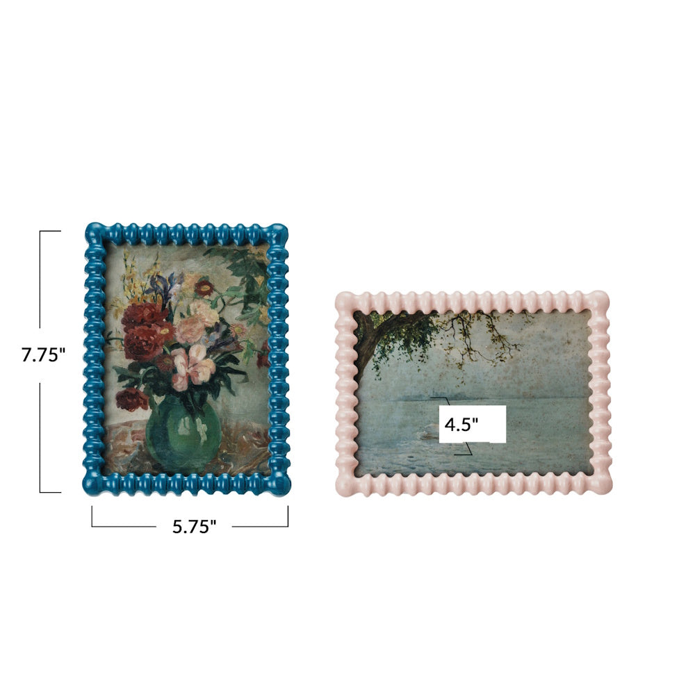 Pair of textured blue and pink picture frames showing dimensions of 7.75 inches high by 5.75 inches wide for the blue frame.