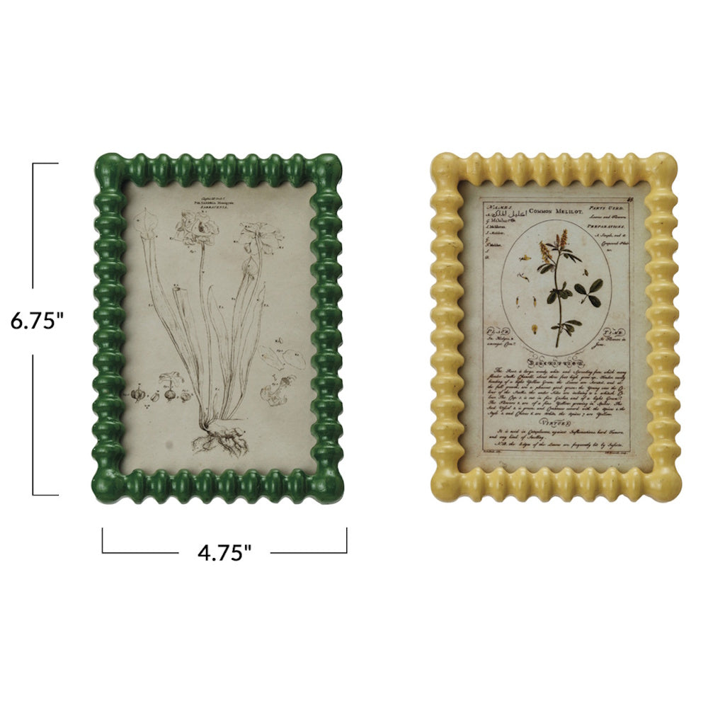 Two small, rectangular picture frames with beaded borders, one green, one yellow, measuring 6.75" by 4.75".