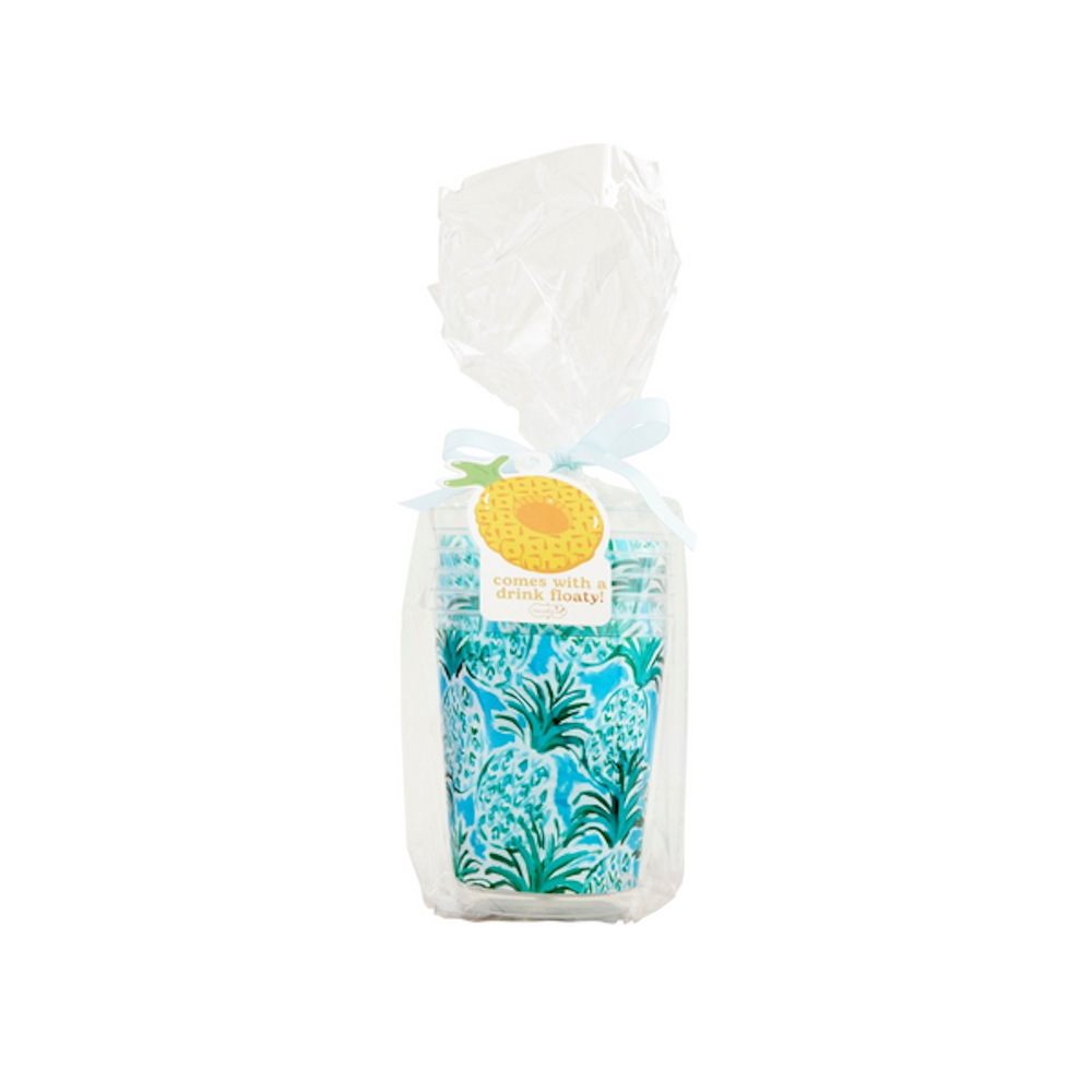 A stack of blue and green pineapple party cups wrapped in clear cellophane with a gift tag and ribbon.