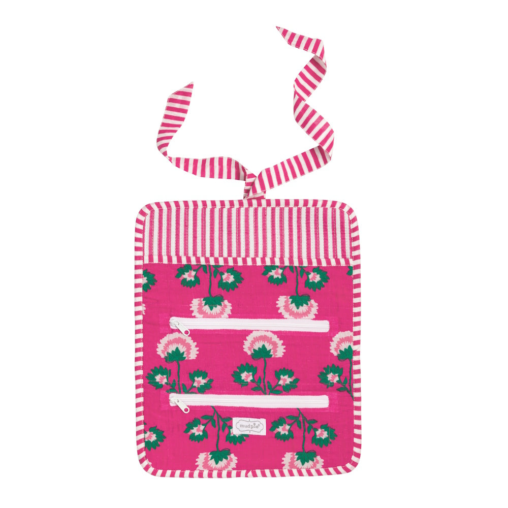 Pink floral block-print jewelry roll with striped trim, two white zipper pockets, and a matching ribbon tie.