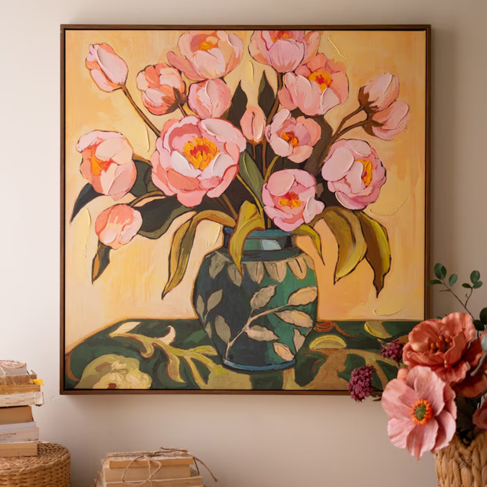 Framed wall art painting of vibrant pink peonies in a patterned teal vase against a warm background.