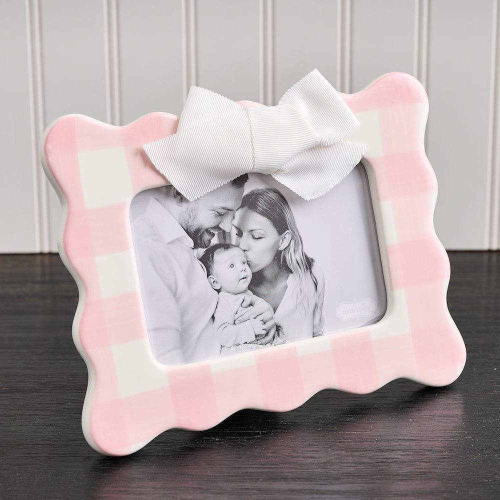 Pink and white gingham scalloped picture frame with a white bow, featuring a black and white family photo.