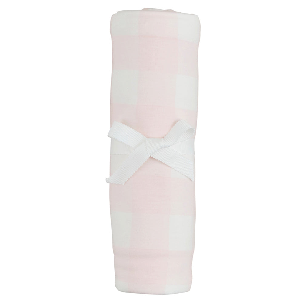 Rolled pink and white gingham soft knit baby swaddle blanket secured with a white grosgrain ribbon bow.