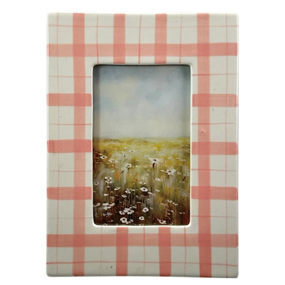 Pink and white checkered ceramic picture frame featuring a wildflower field painting.