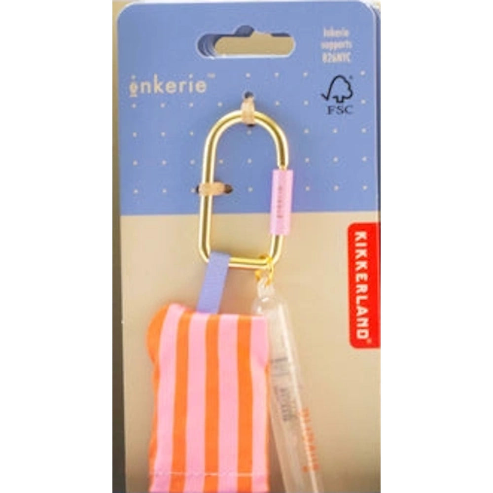 Inkerie on-the-go cleaning kit in retail packaging featuring a striped cloth, spray, and gold carabiner by Kikkerland.