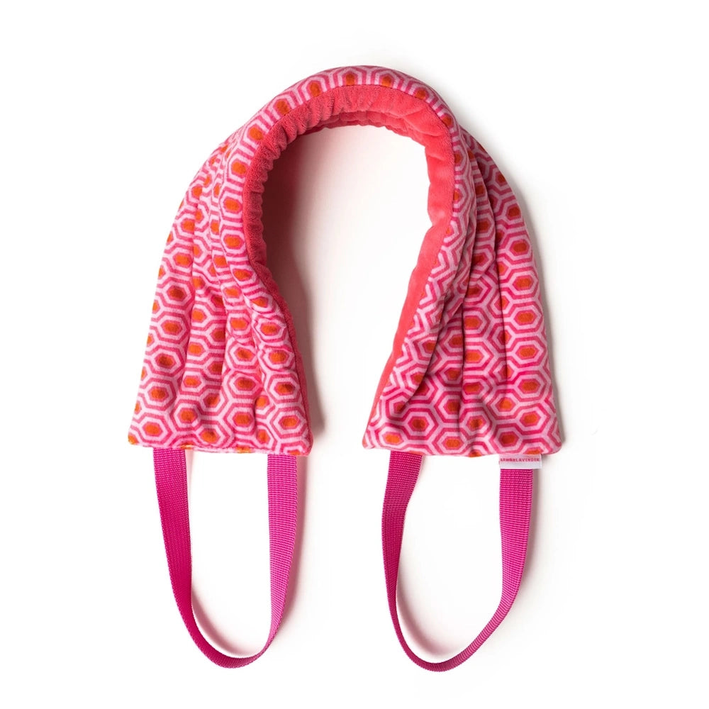 Pink and orange geometric pattern heated neck wrap with plush lining and pink pull straps on a white background.