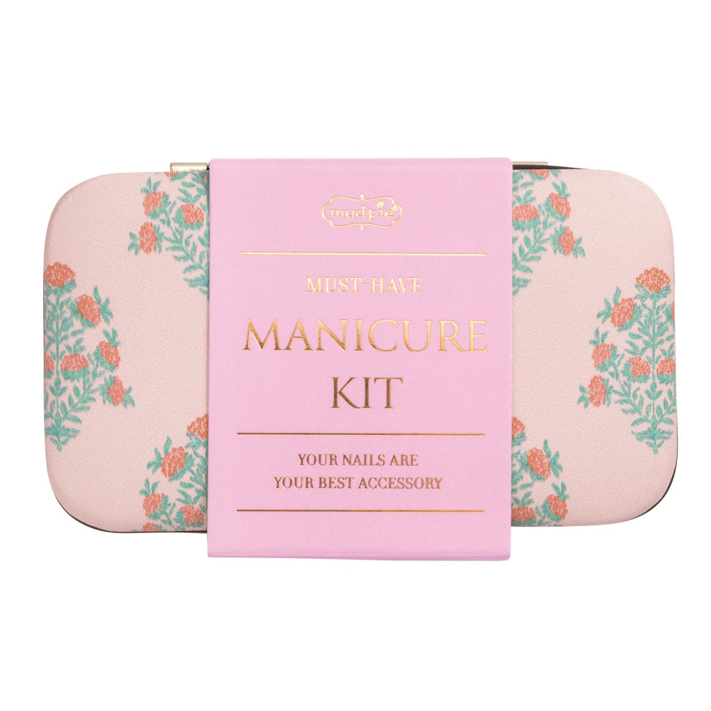 Pink floral Mud Pie manicure kit case with a "Must-Have Manicure Kit" label and gold lettering on a light pink background.