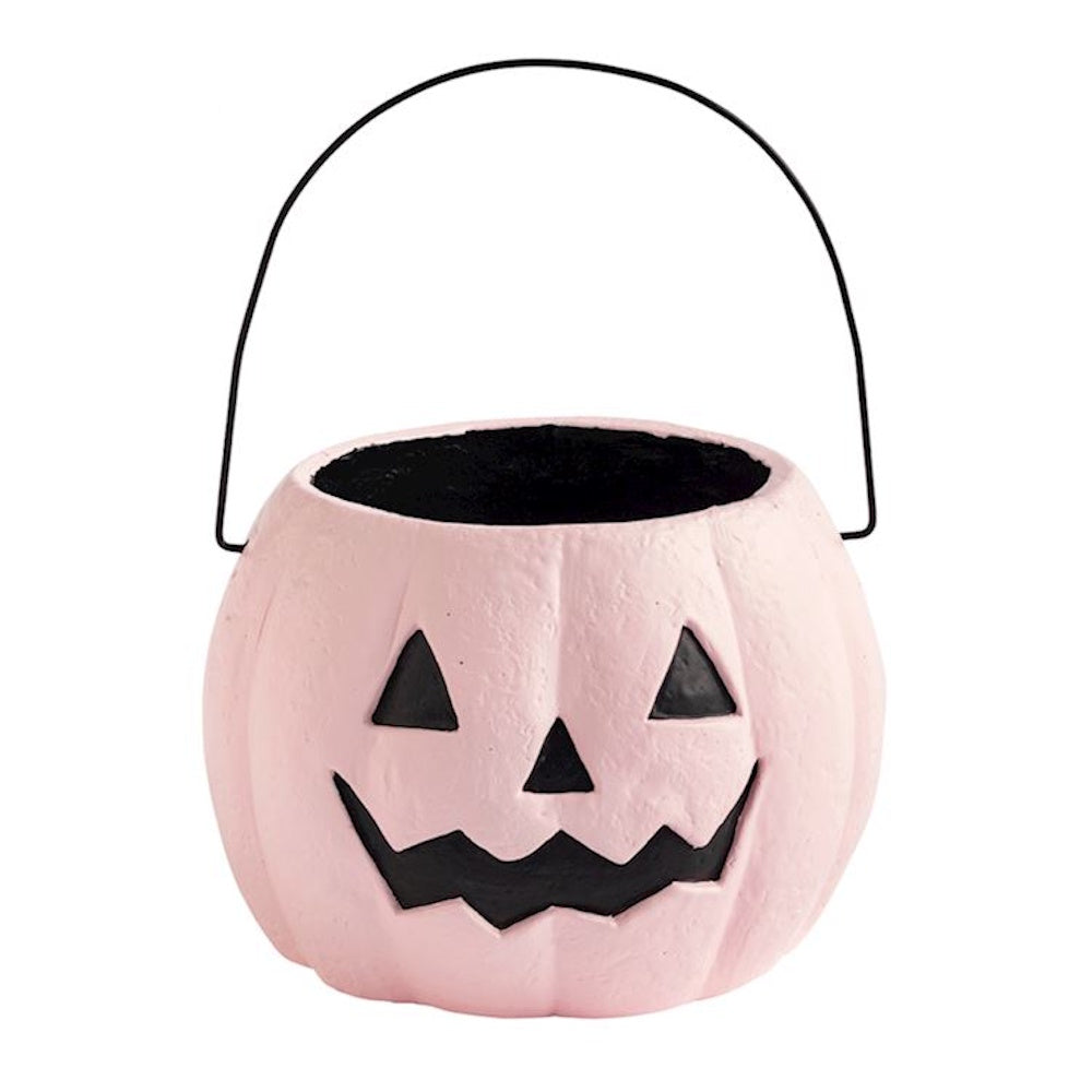 Pink paper mache mini pumpkin bucket with black jack-o'-lantern face and handle.