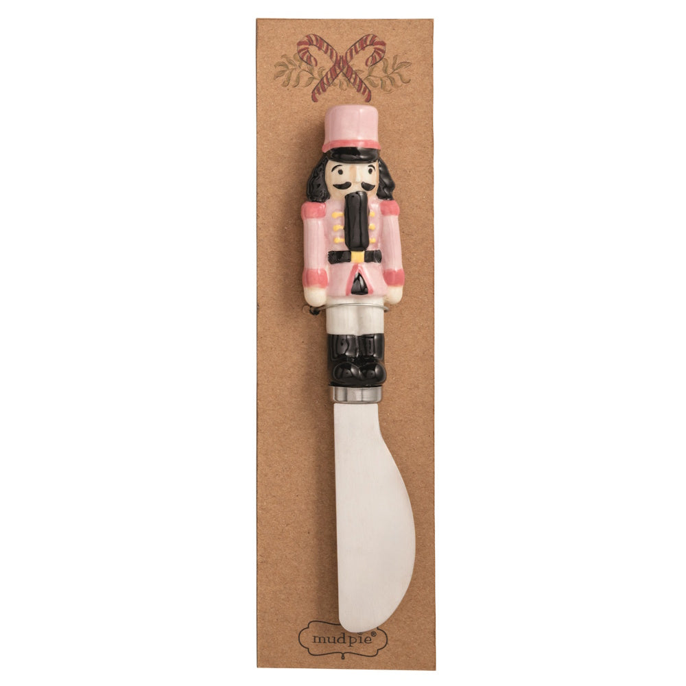 Pink nutcracker Christmas spreader on packaging.