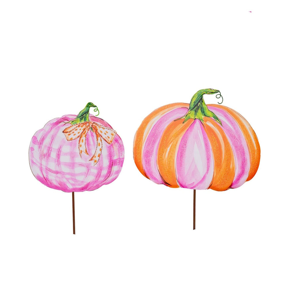 Pink and orange plaid and striped pumpkin garden stakes on a white background for whimsical fall yard decor.