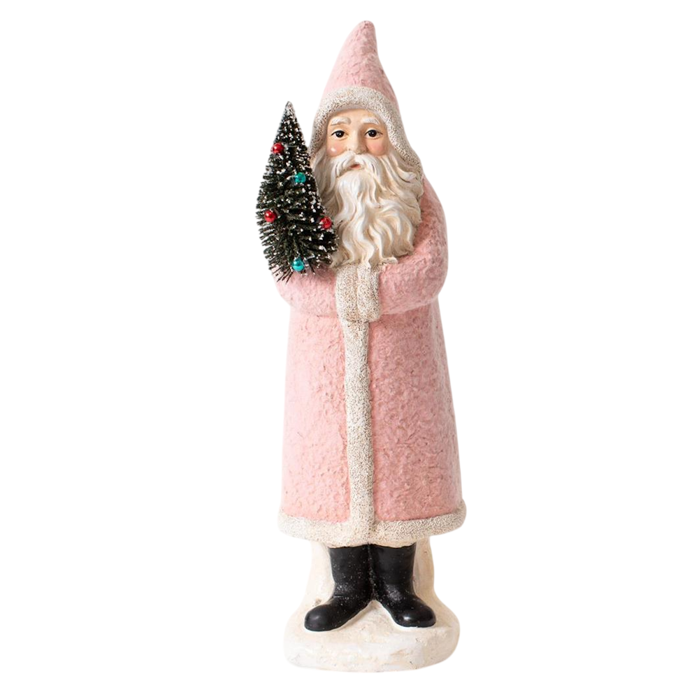 Pastel pink vintage Belsnickel Santa figurine holding a miniature decorated Christmas tree.