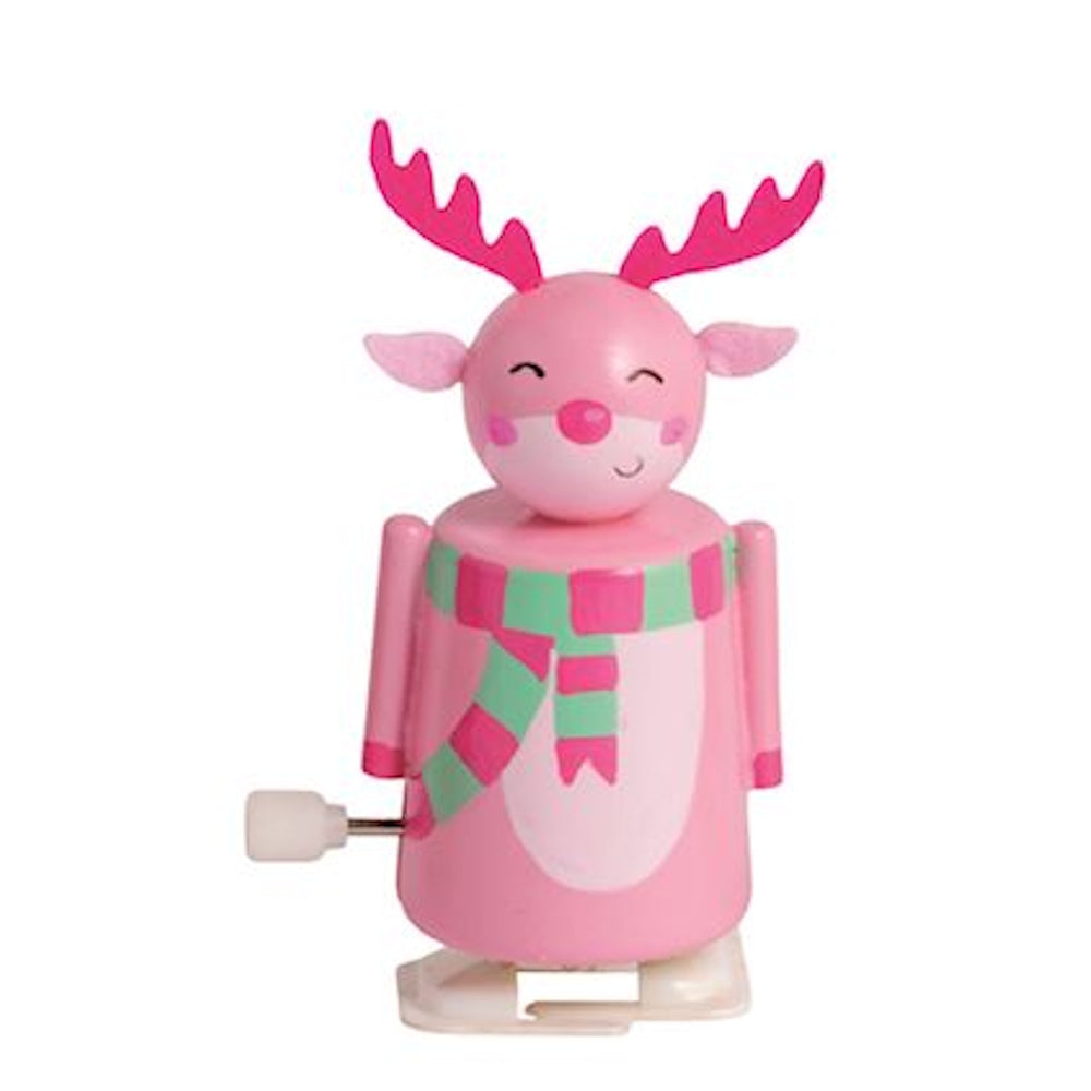 Pink reindeer wind-up toy wearing a pink and green striped scarf, set on a white background.