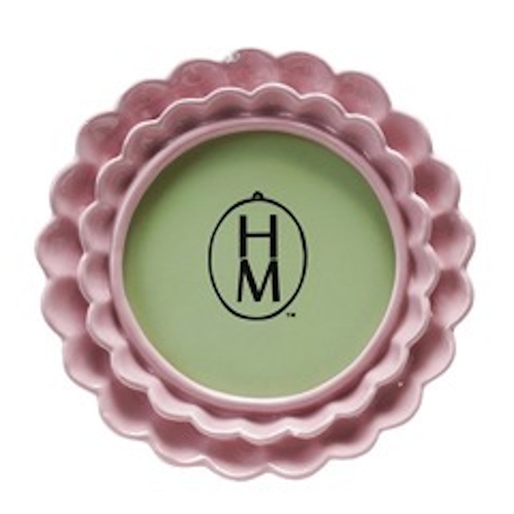 Round pink photo frame with a double-layered ruffled border on a white background.