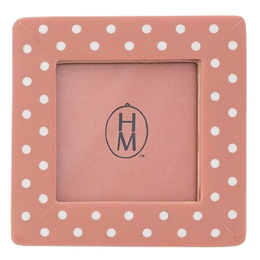 Square pink photo frame featuring a white polka dot pattern around the border.