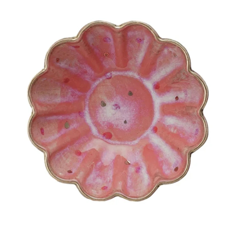 Pink round stoneware fluted dish with a speckled glaze and flower-like scalloped edges.