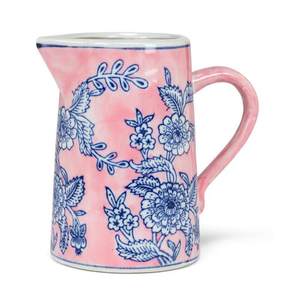Small pink ceramic jug featuring a vintage blue floral botanical pattern.