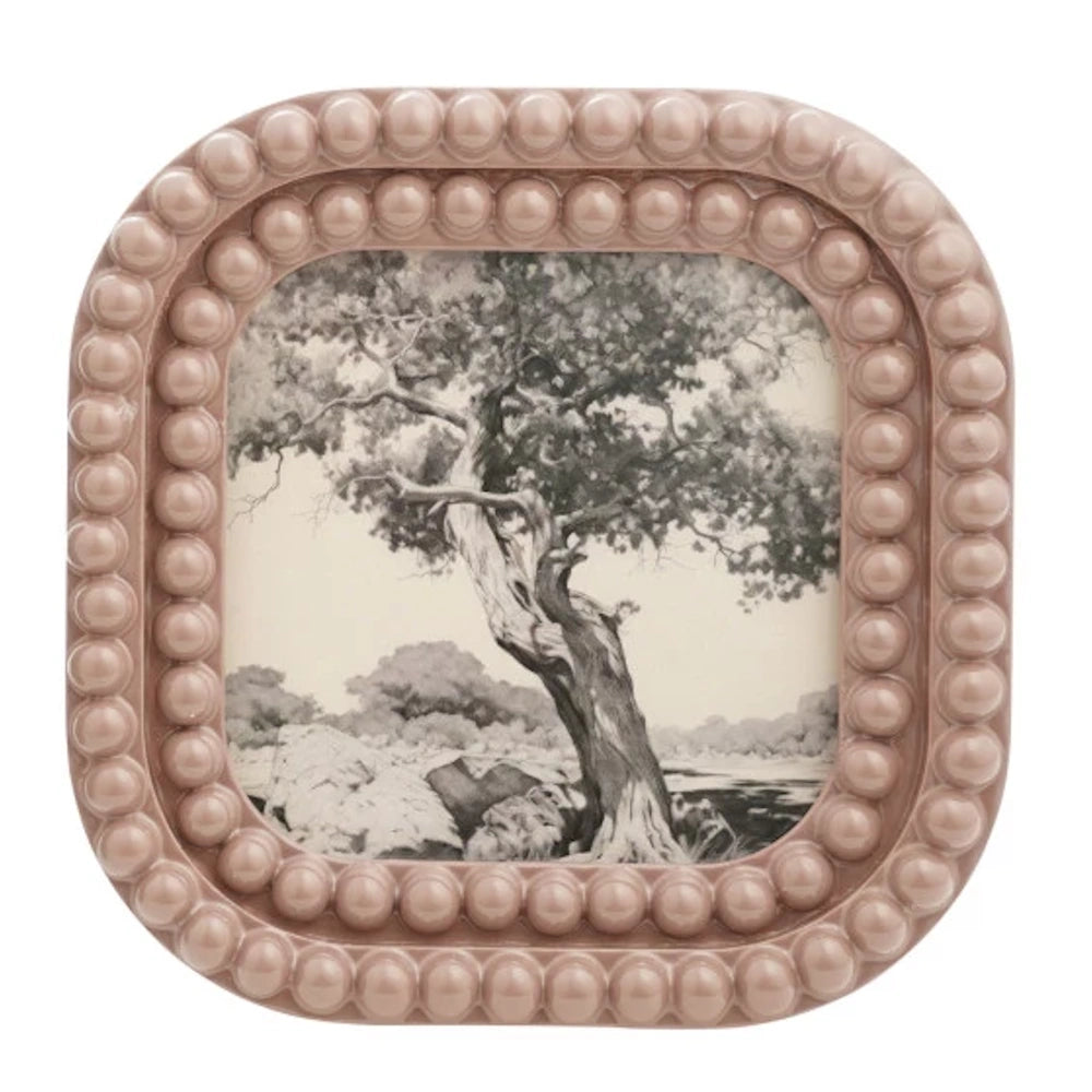 Dusty rose square bobbin resin photo frame featuring a black and white sketch of a leaning tree in a landscape.