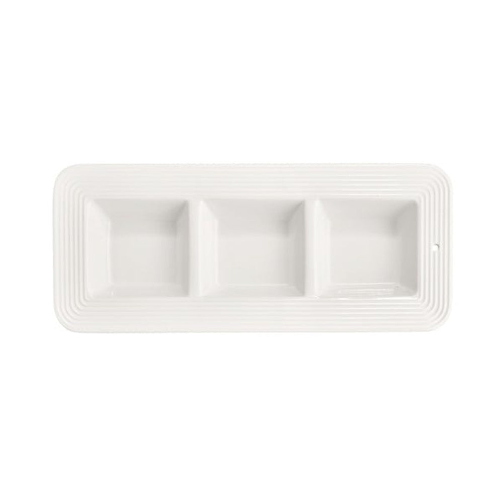 A rectangular white ceramic serving dish divided into three square sections, featuring a ribbed border.