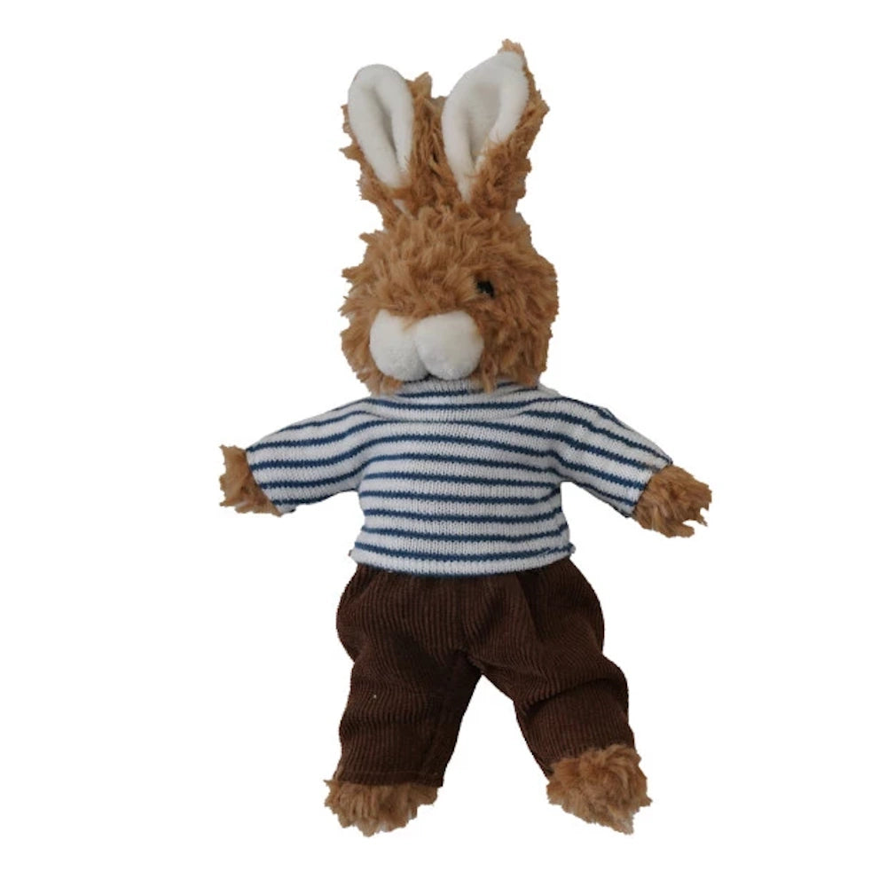 A plush toy bunny standing, wearing a blue and white striped shirt and brown corduroy pants on a white background.