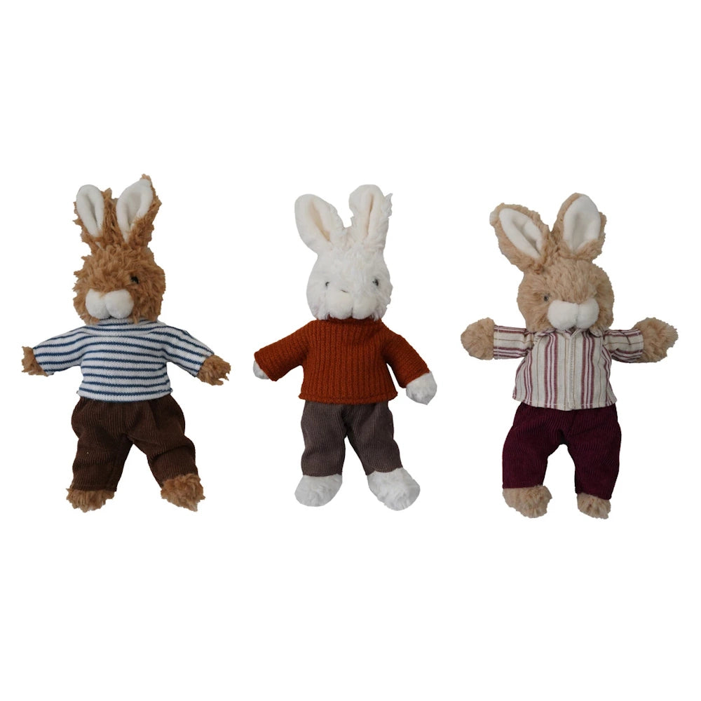 Three plush toy bunnies wearing a striped shirt, orange sweater, and button-up shirt with trousers.