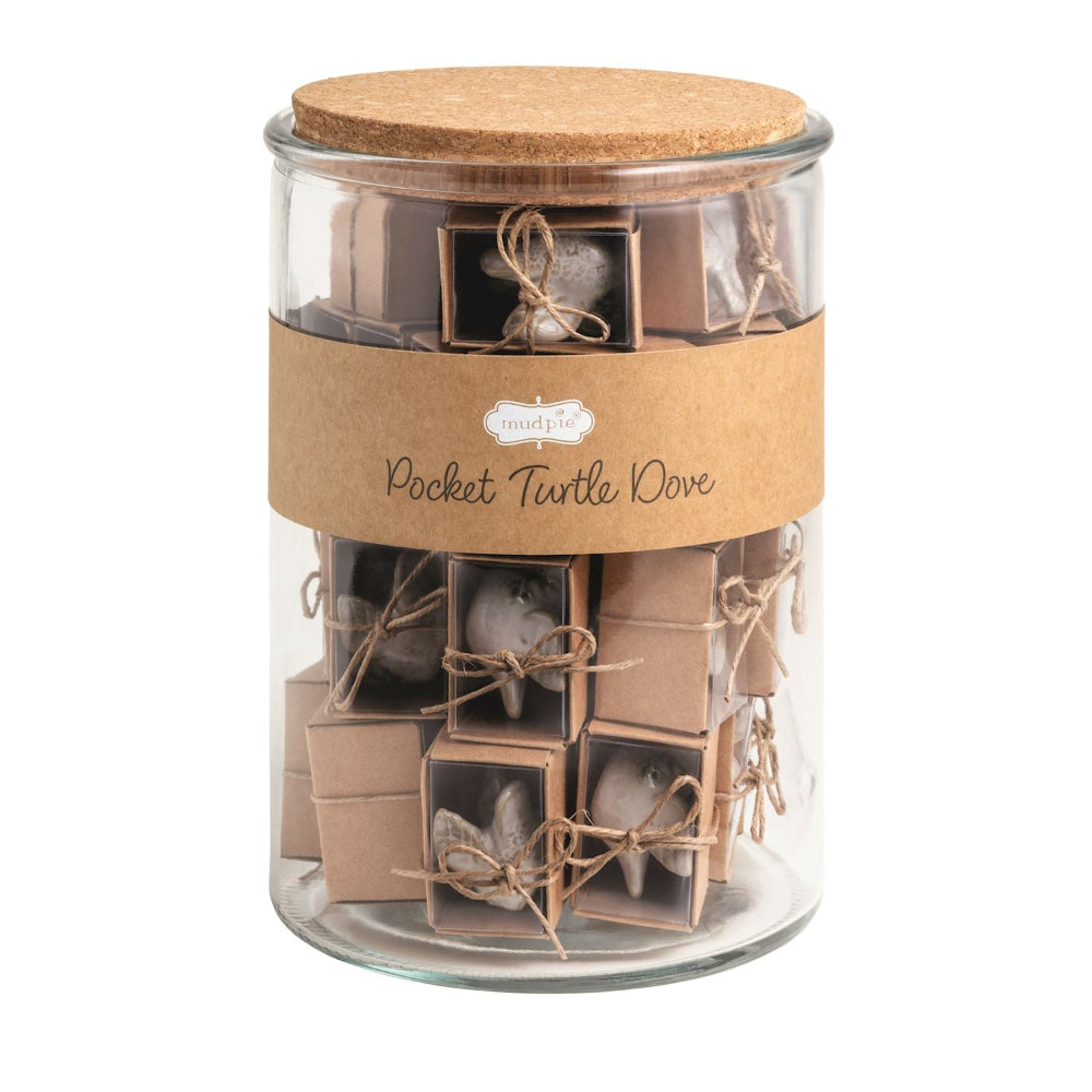 Glass jar filled with mini boxed Pocket Turtle Dove figurines tied with jute twine.