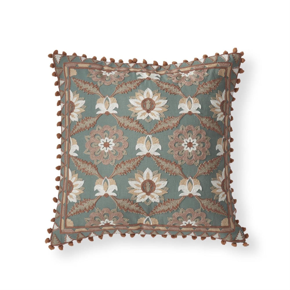 Teal embroidered floral throw pillow with pink and cream botanical patterns and brown pom-pom trim.