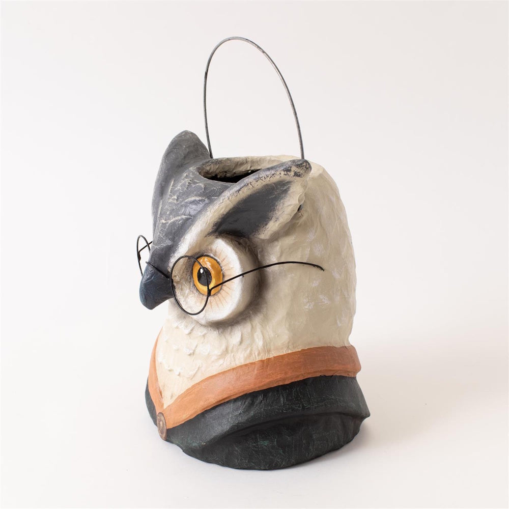 Side view of an owl bucket with wire-rimmed glasses, a coat collar, and a thin wire handle.