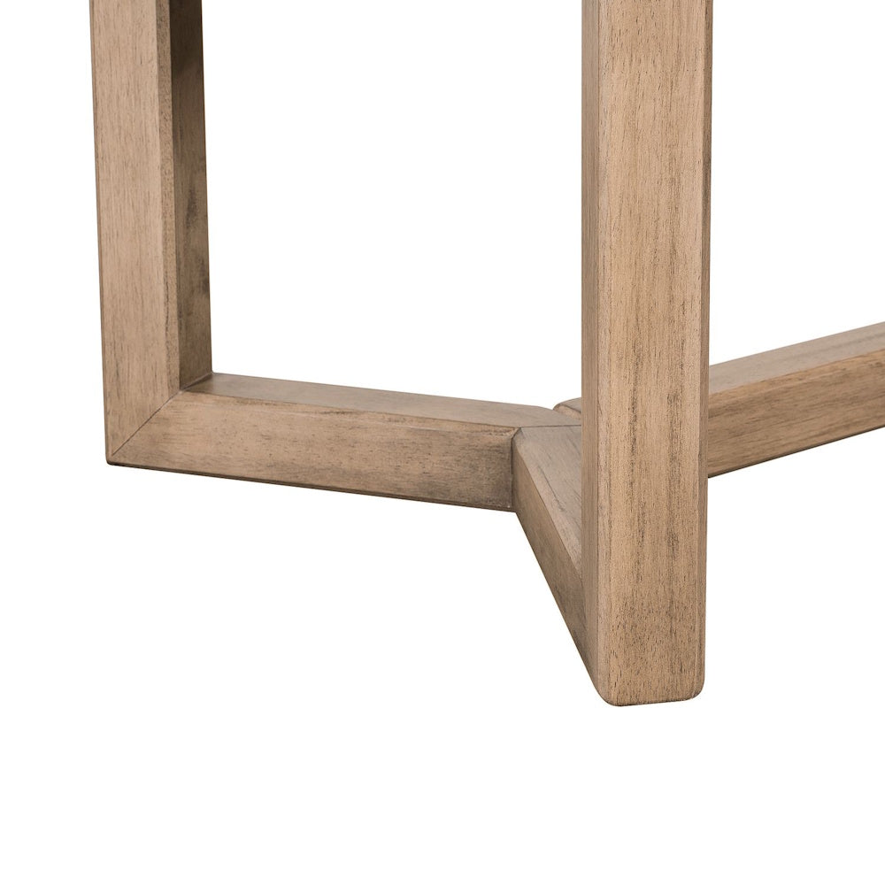 Close up of Proximity Place rectangular cocktail table light wood base.