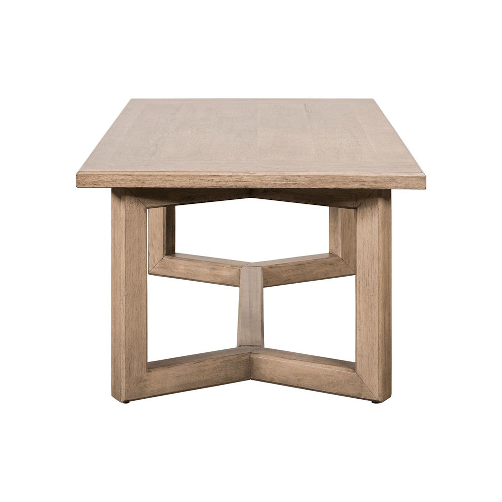 Side profile view of Proximity Place rectangular wood cocktail table showing trestle base design.