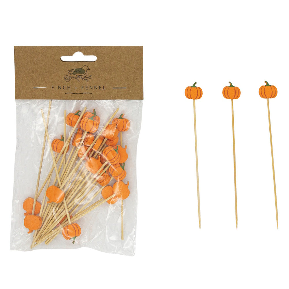 Bamboo food picks with orange pumpkin toppers, packaged in a clear bag next to three loose picks.