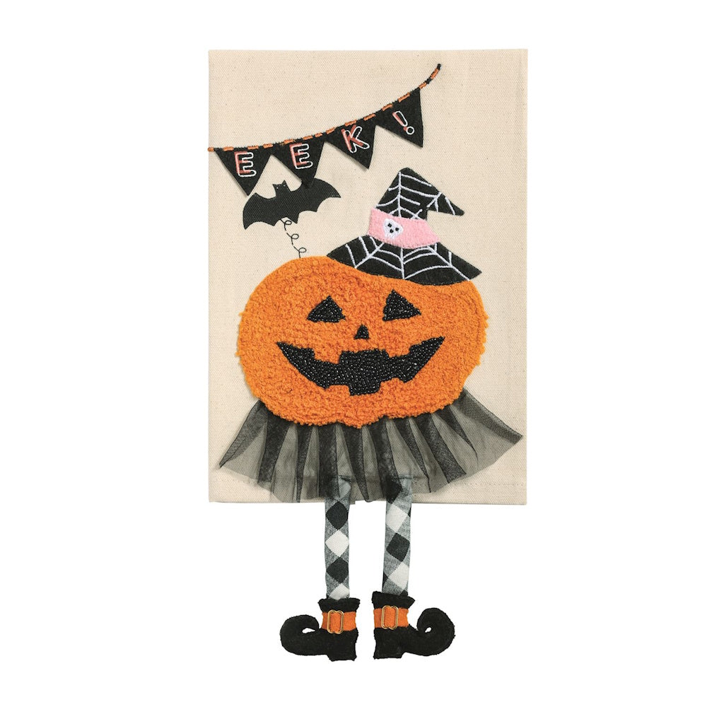 Beige Halloween towel featuring a pumpkin in a witch hat and skirt with dangling legs.