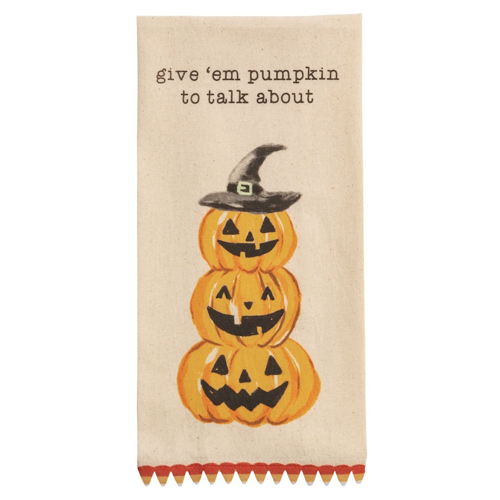 Halloween kitchen towel featuring stacked jack-o'-lanterns and "give 'em pumpkin to talk about" text.