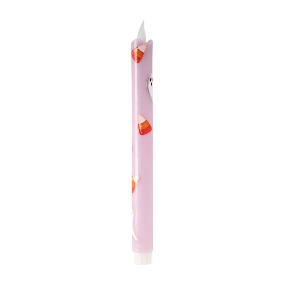 Purple Halloween LED taper candle decorated with candy corn and ghost patterns on a white background.