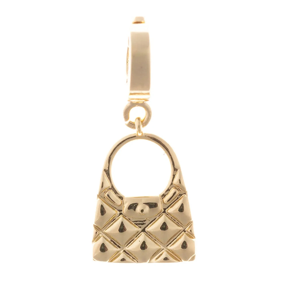 Gold charm shaped like a quilted handbag with a rounded top handle and small front flap latch.