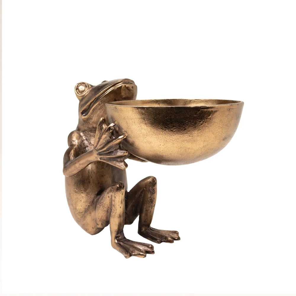 Side profile of a bronze frog sculpture holding a large round bowl on a white background.