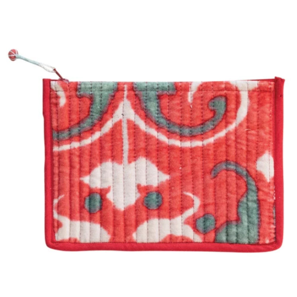 Small flat quilted cotton velvet zip pouch with a red, white, and green damask-style pattern and a beaded zipper pull.