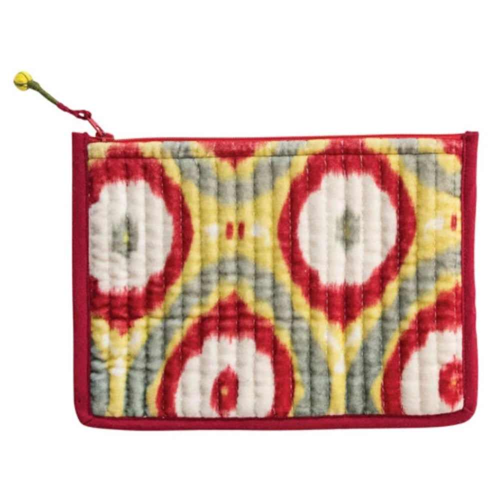 Quilted cotton velvet zip pouch with a red, yellow, and grey ikat pattern and a top zipper with a green and yellow pull.