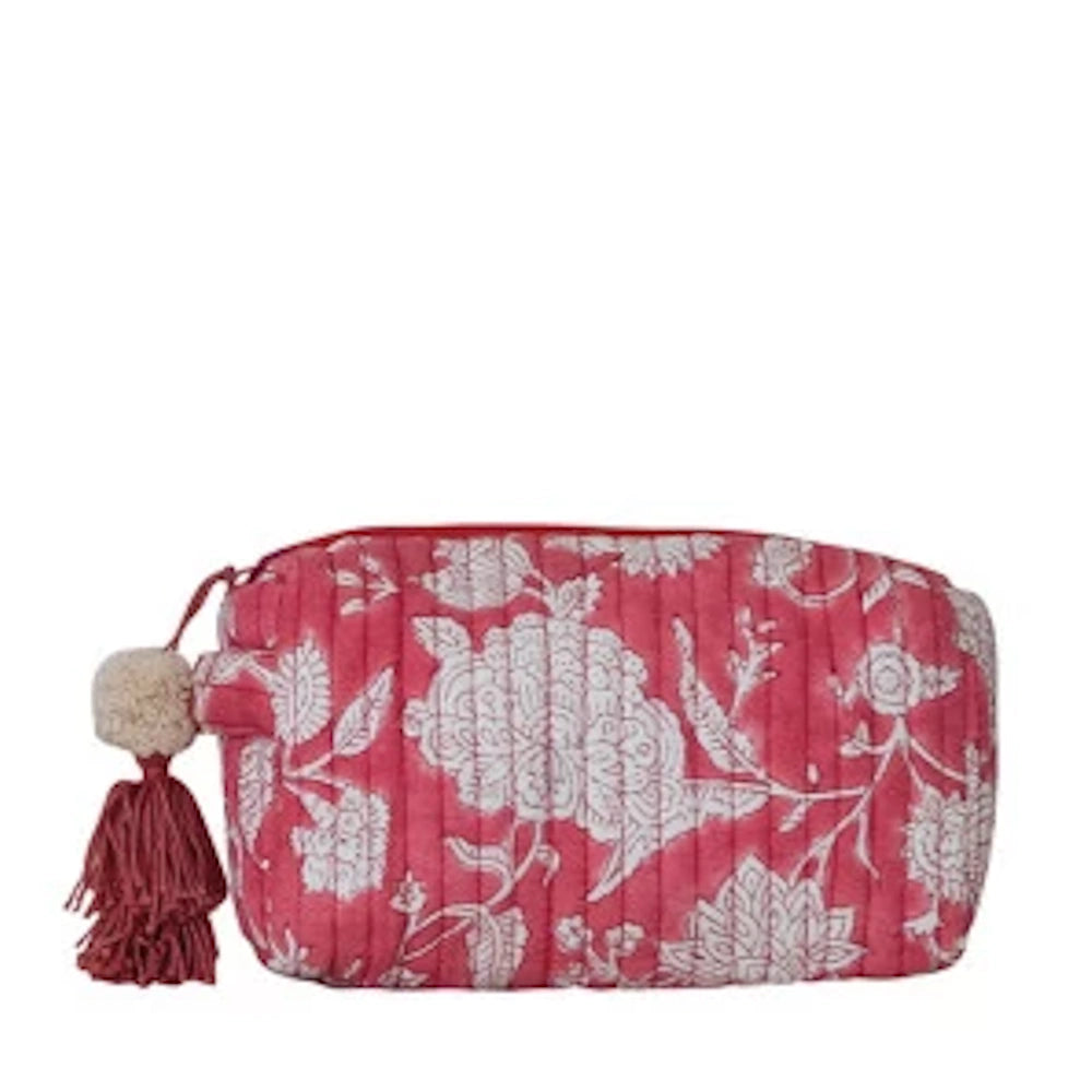 Quilted pink floral cotton zip pouch with white flower pattern and decorative tassel.