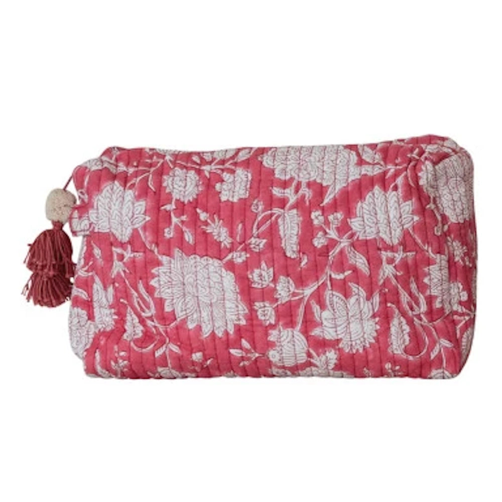 Pink floral quilted cotton zip pouch with white botanical patterns and a decorative tassel zipper pull.