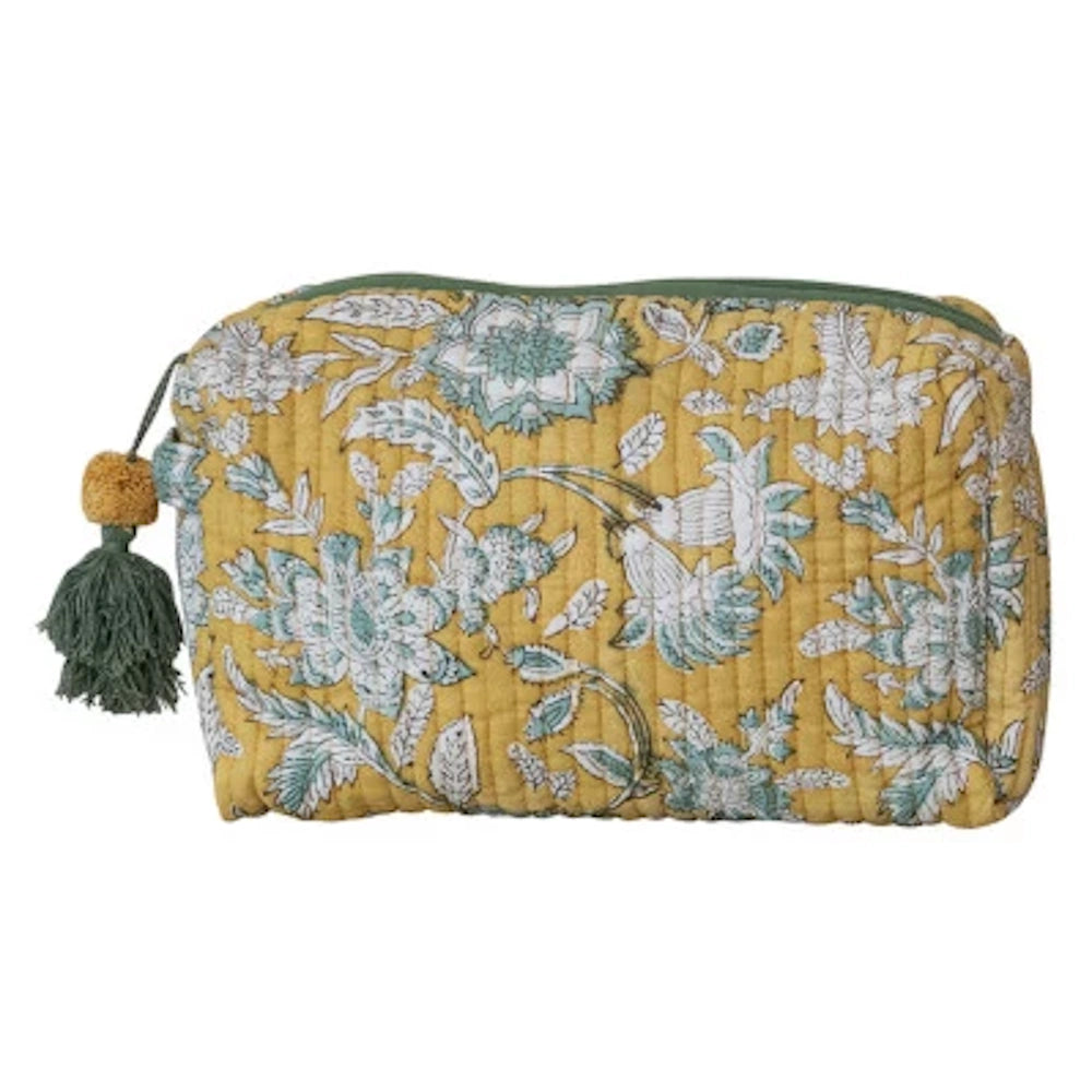 Yellow quilted cotton zip pouch with green and white floral block print and a decorative green tassel.