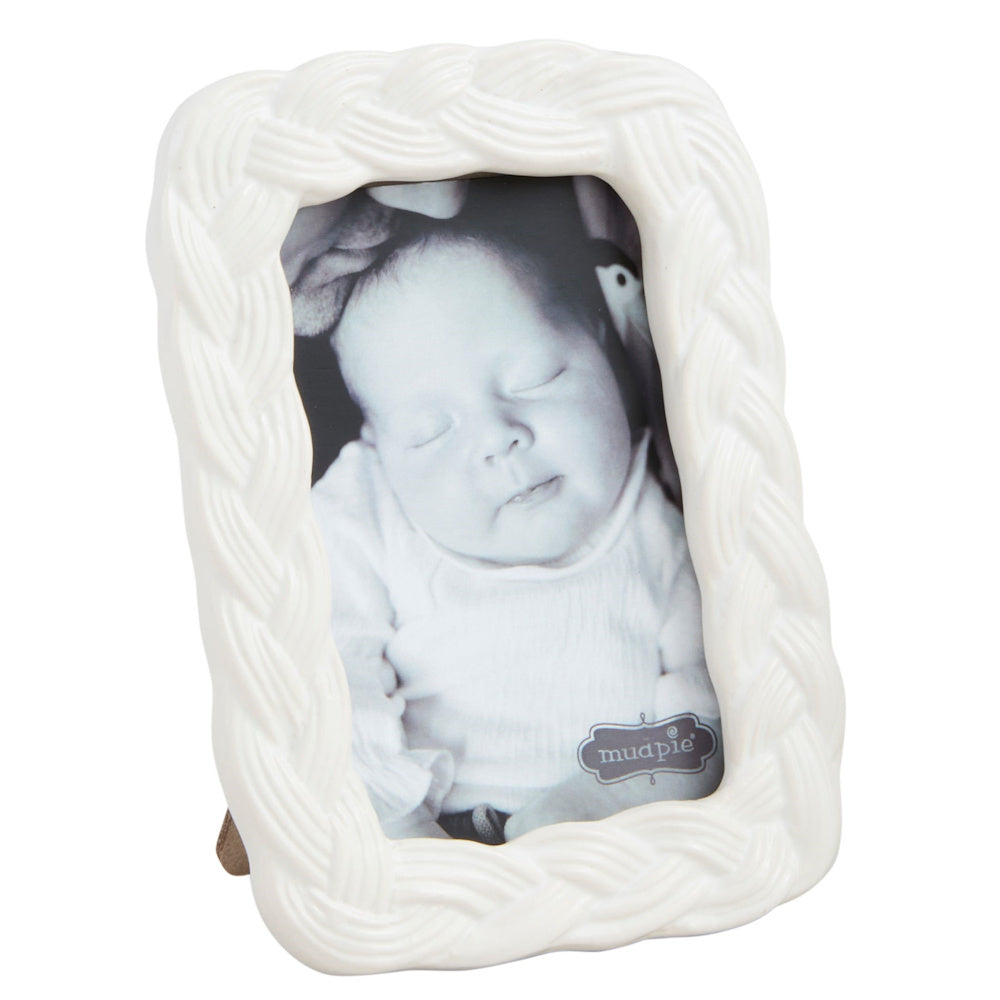 Mini white braided stoneware picture frame by Mud Pie featuring a black and white photo of a sleeping baby.