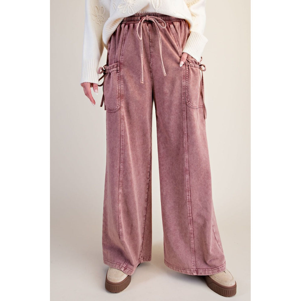 Front view of dusty rose washed terry knit wide-leg pants with drawstring waist and tie-accent pockets.