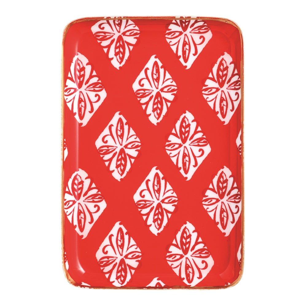 Rectangular red metal Christmas tidbit plate with a block-print style floral pattern.