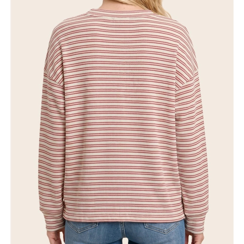 Back view of a red and cream horizontally striped long-sleeve waffle knit top.